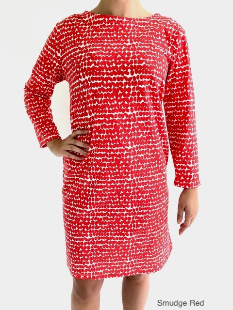 A woman in a comfortable, versatile See Design Knit Dress 3/4 Sleeve.