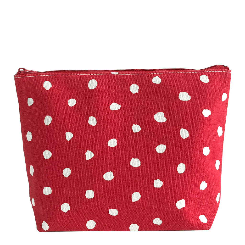 A Travel Pouch Extra Large with red and white polka dot design by See Design.