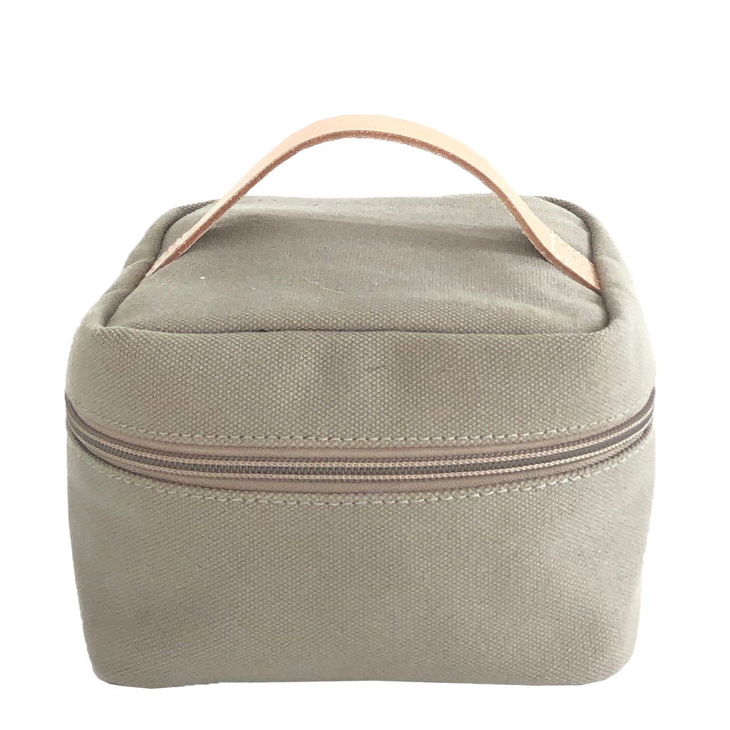 A grey canvas Train Case Small with leather handles, perfect for travel. (Brand: See Design)