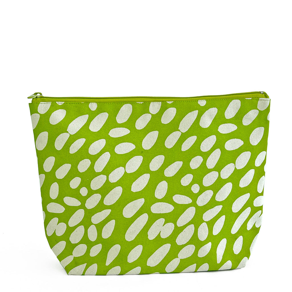 A polka dot Travel Pouch Extra Large cosmetic bag for packing essentials by See Design.
