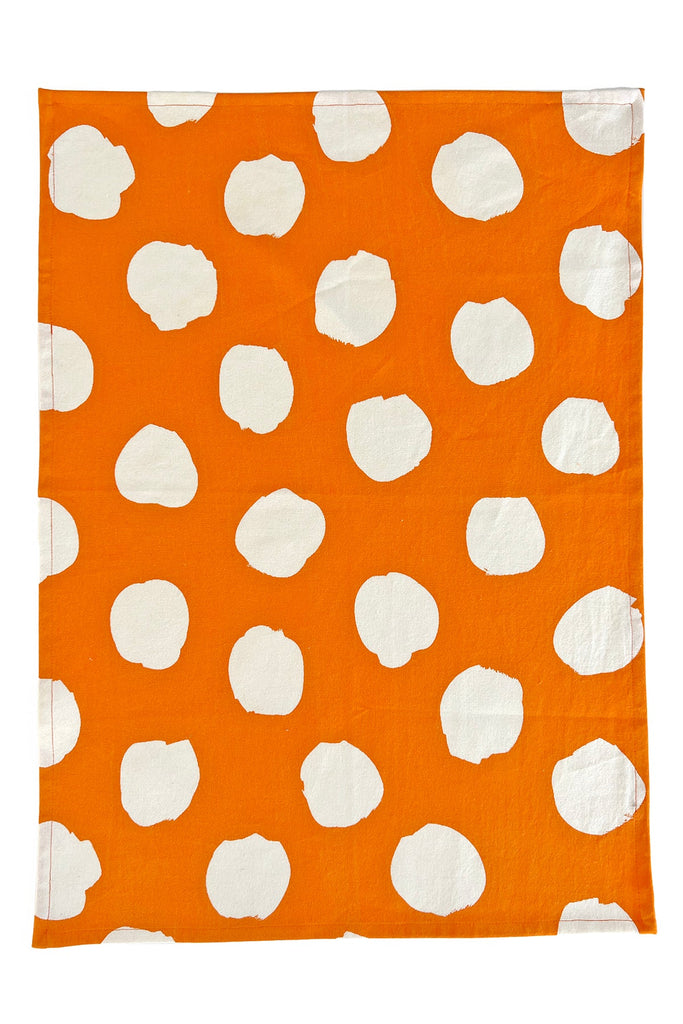 Vibrant orange and white polka dot tea towel (set of 2) with hand painted designs from See Design.