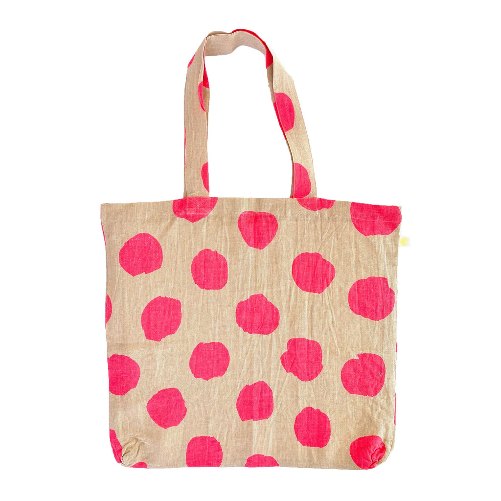 A sturdy pink polka dot Linen Everyday Tote Bag by See Design.