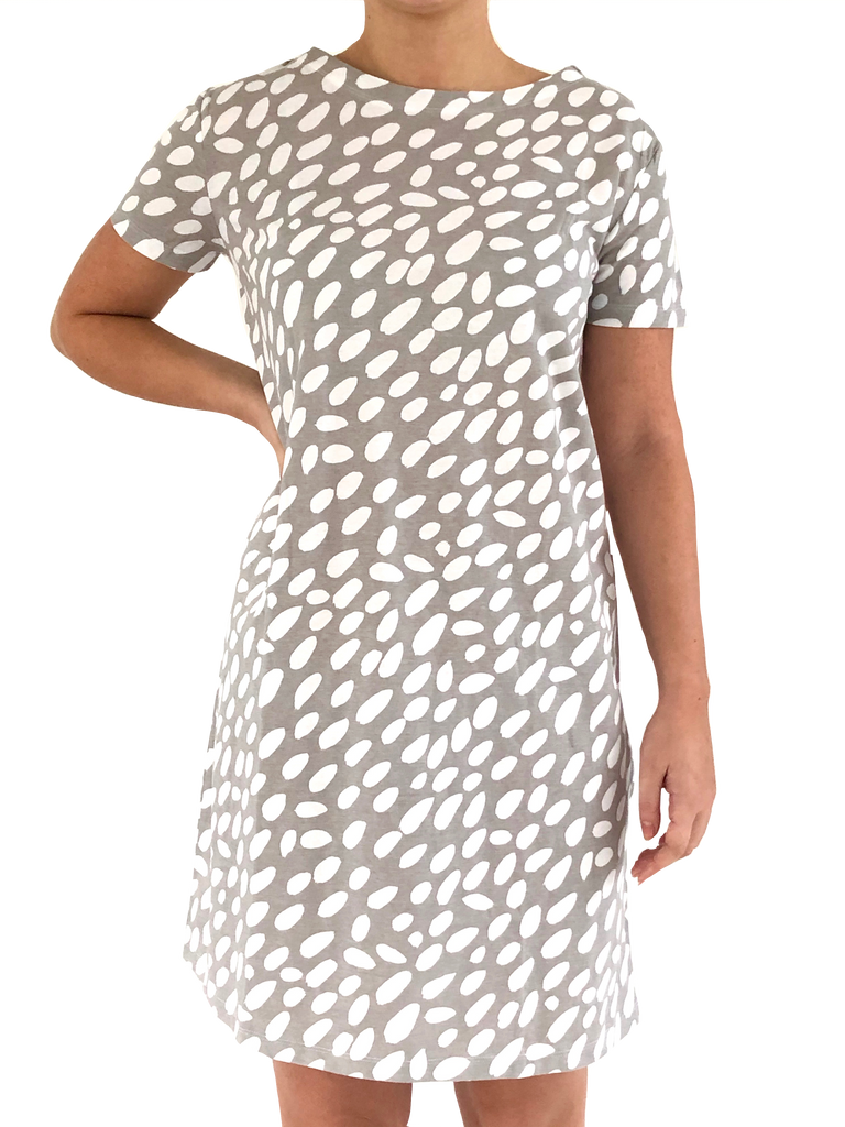 A woman wearing a comfortable and versatile See Design Knit Dress Short Sleeve.
