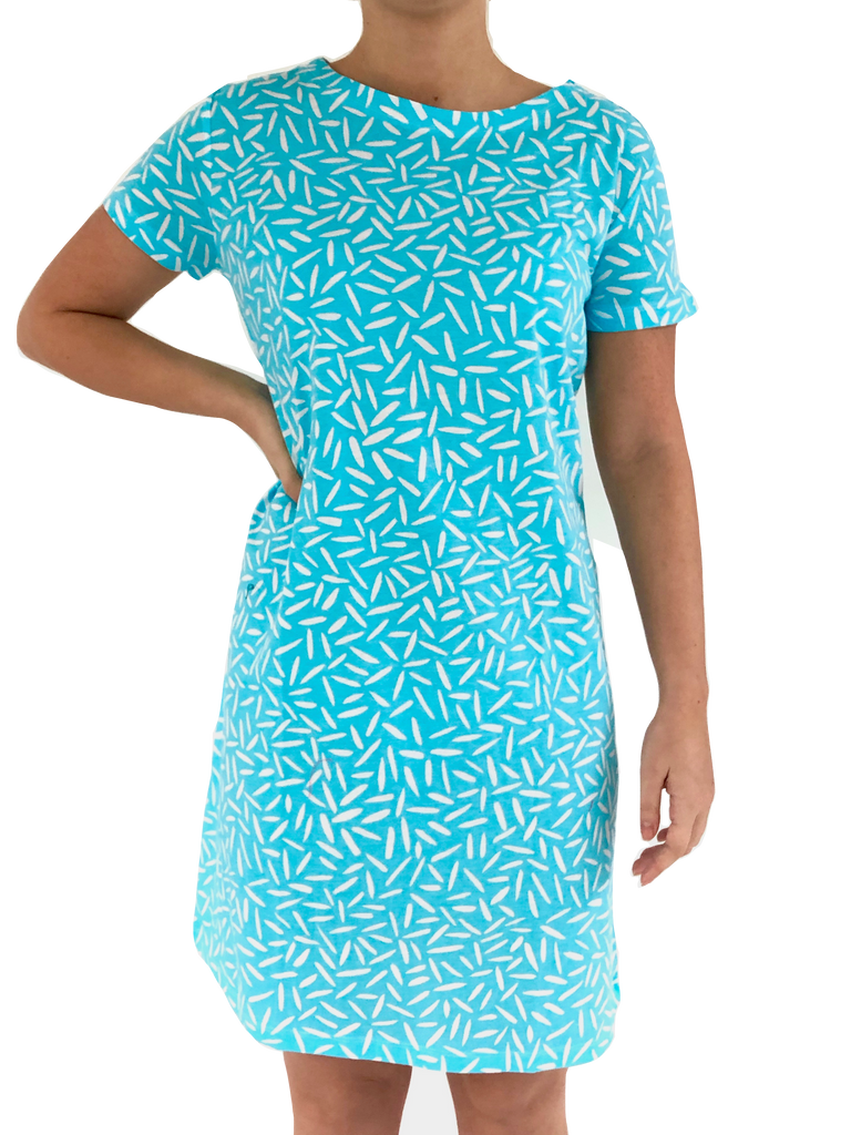 A woman wearing a comfortable and versatile See Design blue and white Knit Dress Short Sleeve.