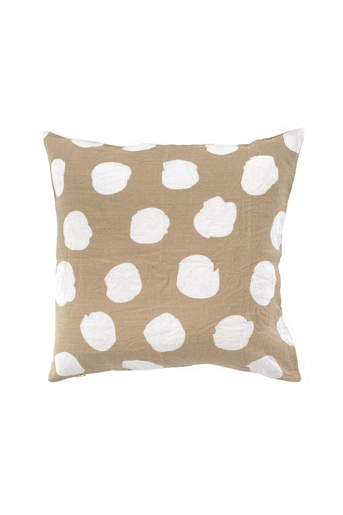 A hand-painted, See Design linen 20" pillow cover with white polka dot designs.