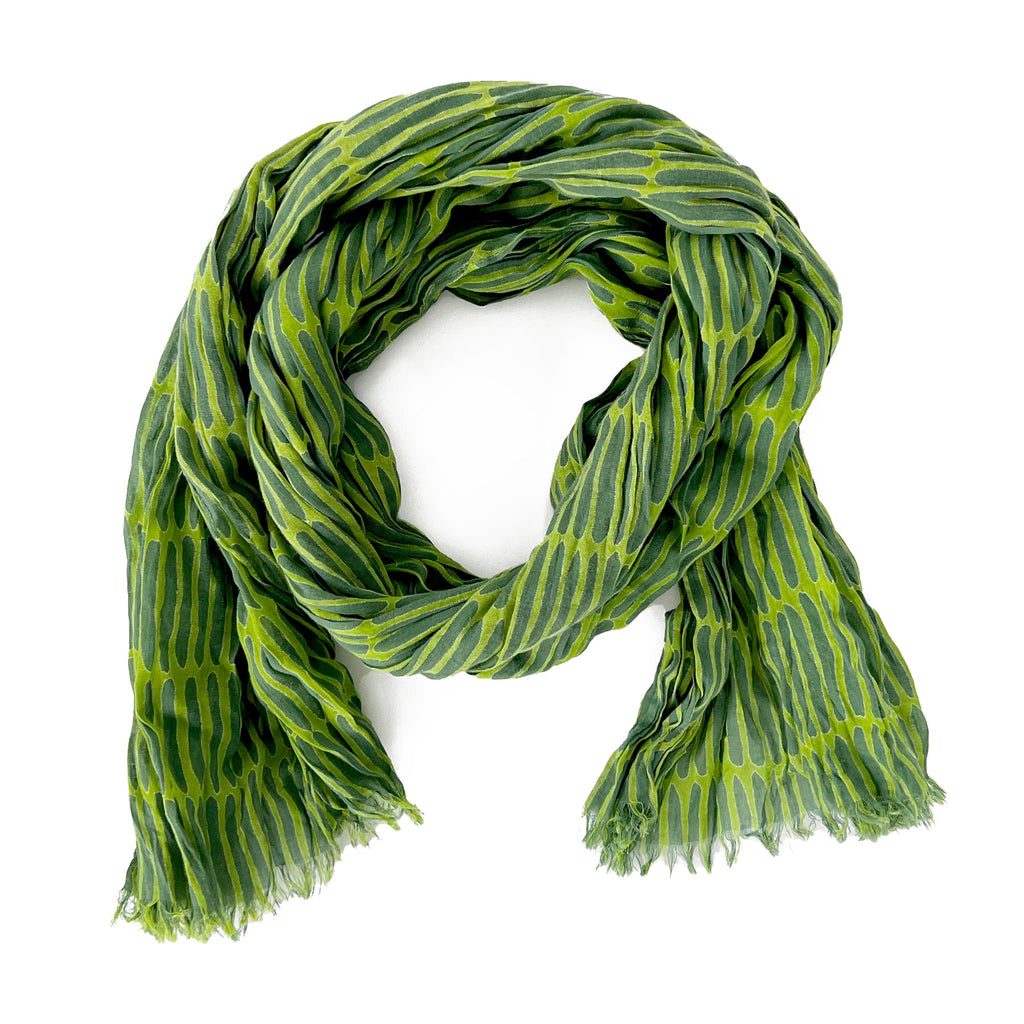 A lightweight green and black See Design cotton scarf with a crinkled texture, displayed on a clean white background.