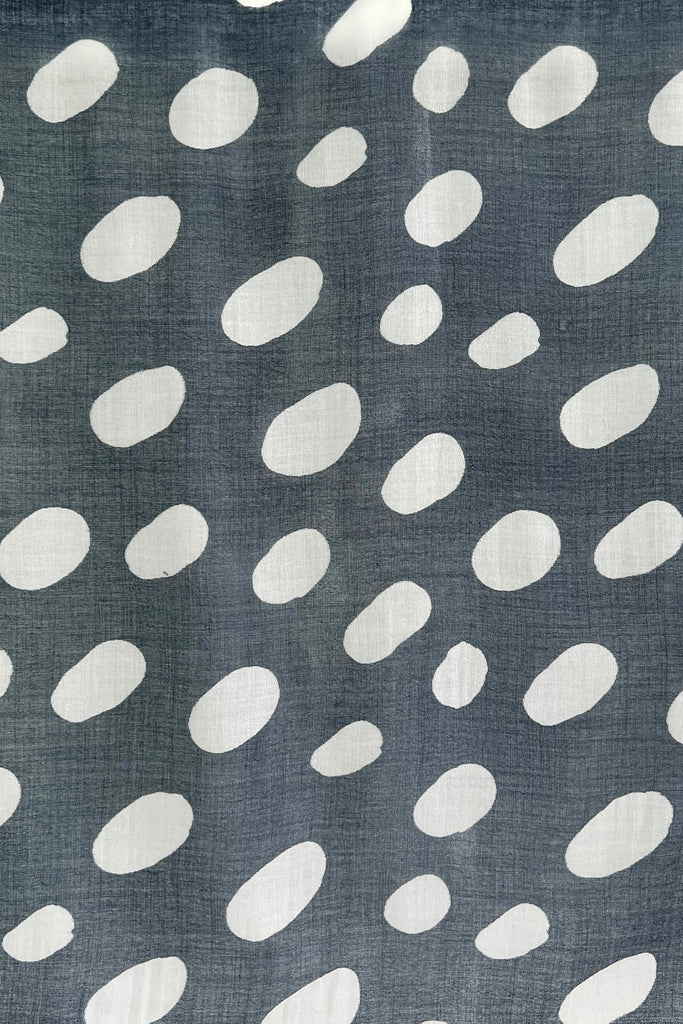 A light weight See Design grey and white polka dot Wool Scarf fabric.
