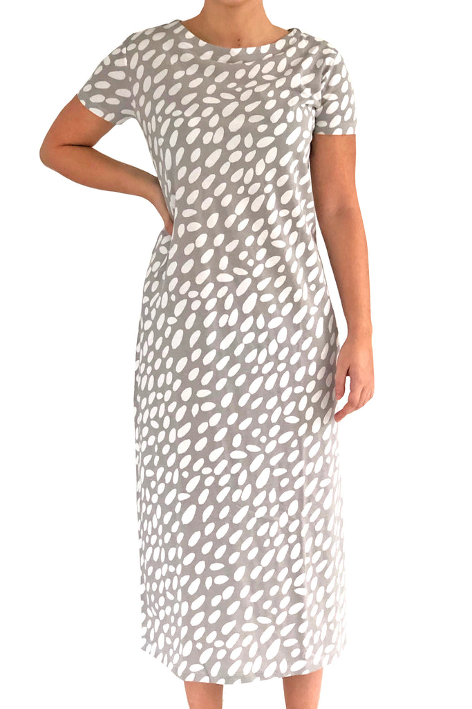 A woman wearing a comfortable See Design Knit Dress Full Length.