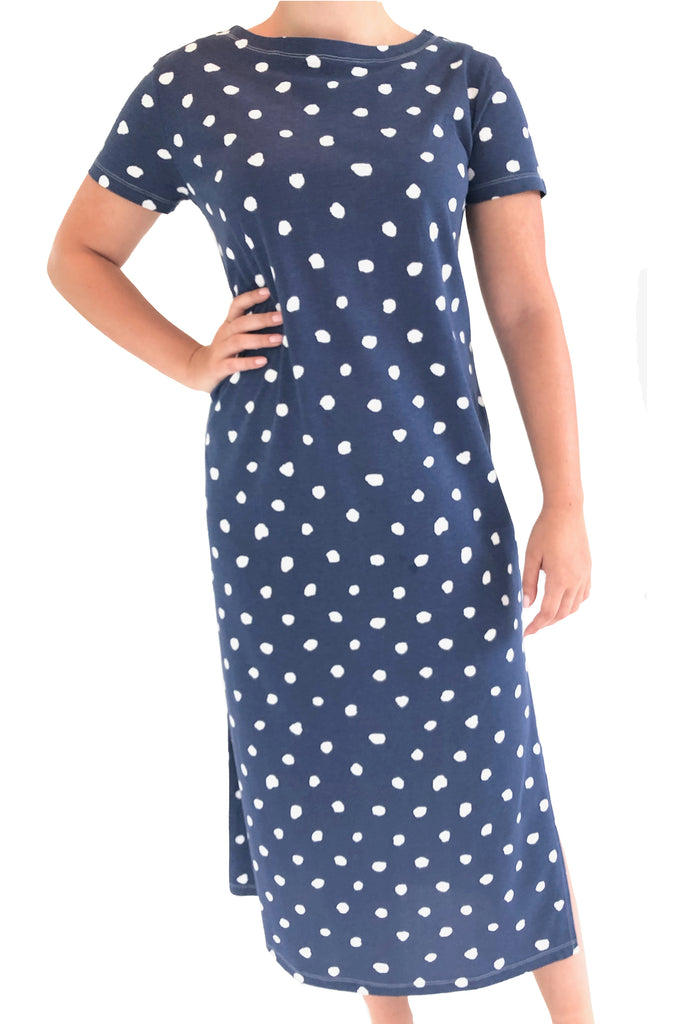 A woman wearing a longer navy See Design Knit Dress Full Length.