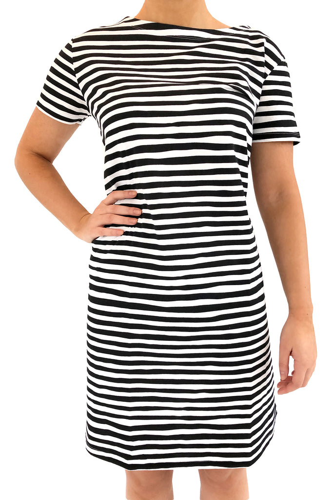 A woman wearing a comfortable See Design Knit Dress Short Sleeve.