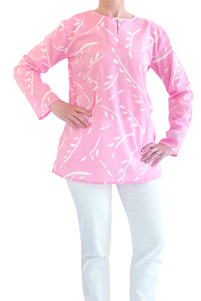 A woman wearing a lightweight pink See Design tunic in cotton voile.
