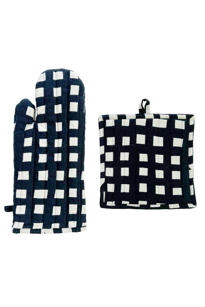 The Oven Mitt & Potholder Set by See Design includes a durable cotton black and white checkered oven mitt displayed alongside a matching potholder, each featuring looped fabric for easy hanging.
