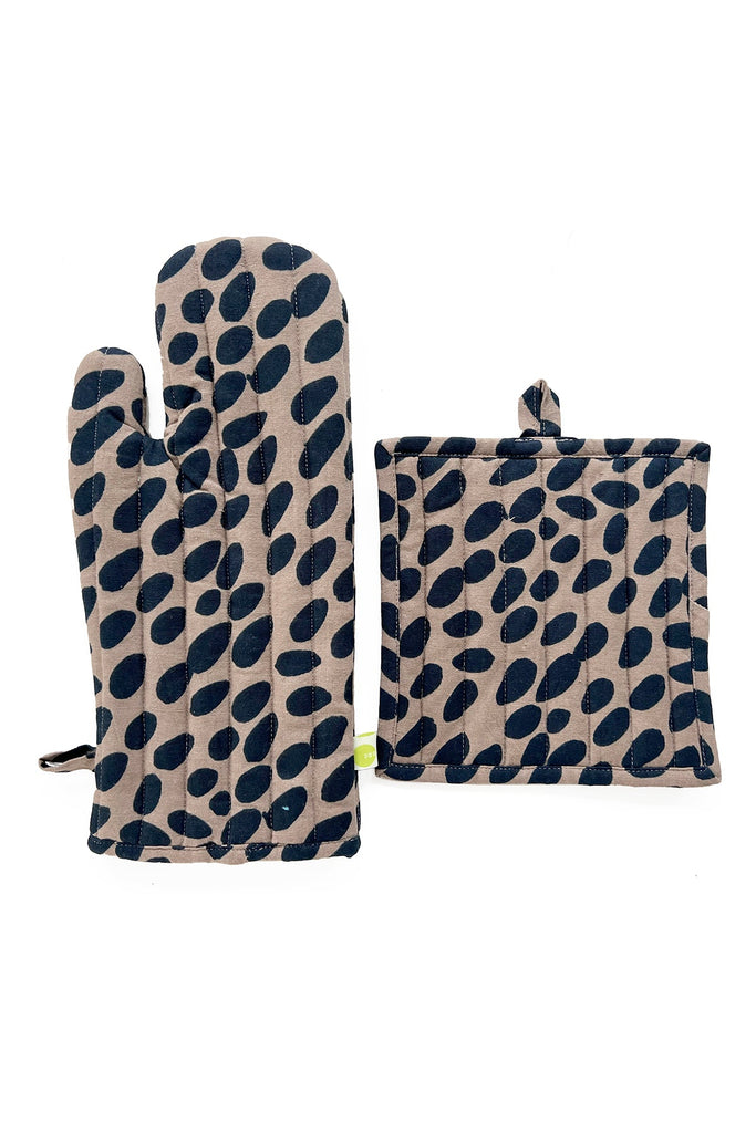The See Design Oven Mitt & Potholder Set includes a grey oven mitt and matching 100% cotton potholder, each featuring a black leaf-pattern design on a plain white background.