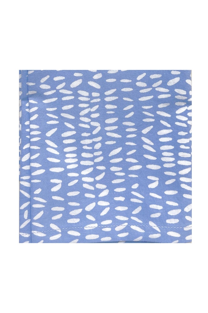Blue cotton cocktail napkins (set of 4) by See Design, featuring a pattern of vertically aligned irregular white ovals reminiscent of hand-painted designs.