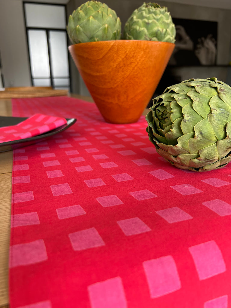 A colorful cotton table runner with artichokes prints from See Design.