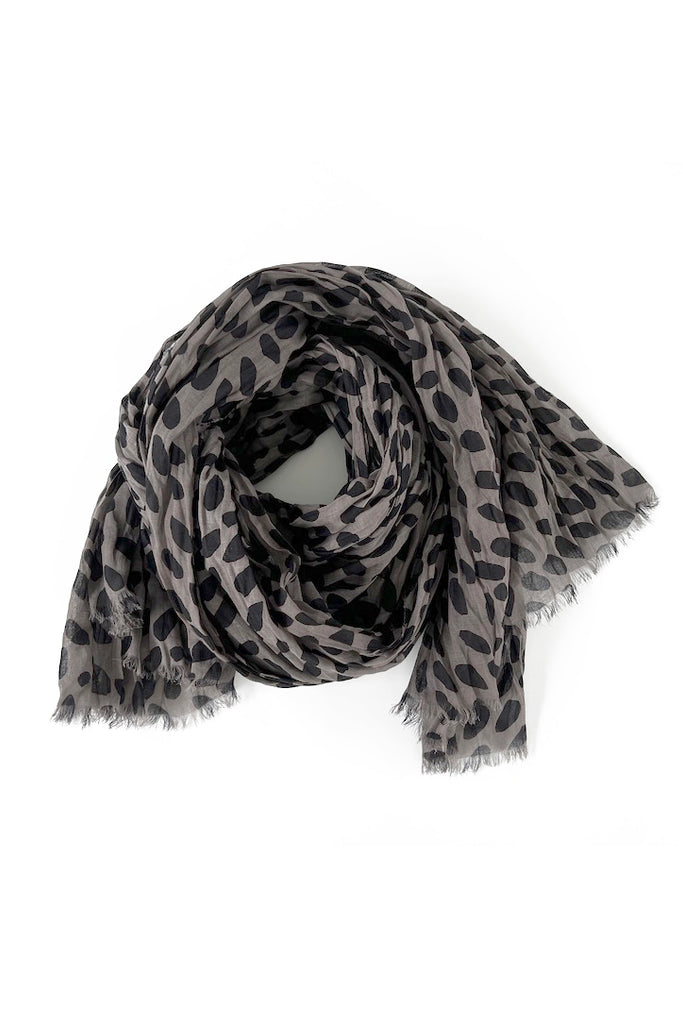 A soft lightweight grey and black leopard print Cotton Scarf on a white background from See Design.