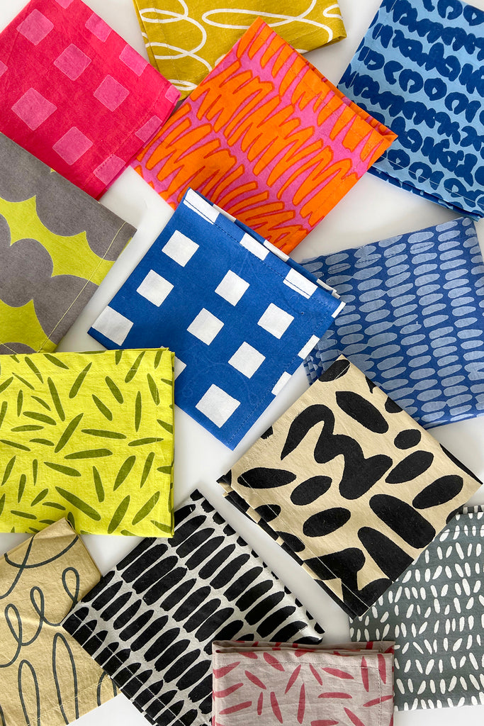 A set of Cocktail Napkins from See Design with hand painted designs, perfect for cocktail hour.