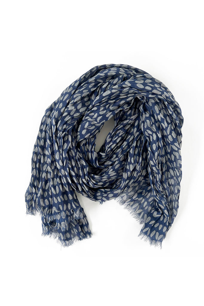 A blue and white See Design crinkled cotton scarf on a white background.