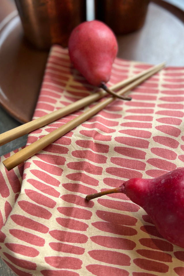 Colorful See Design napkins (Set of 4) with hand painted designs showcase two pears on a plate.