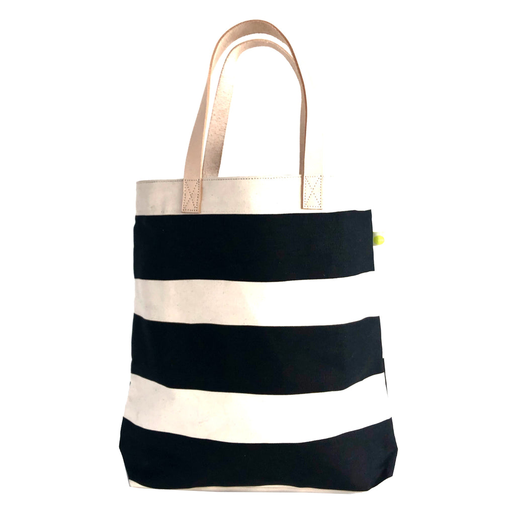 A See Design tall black and white striped tote bag made of cotton heavyweight canvas.