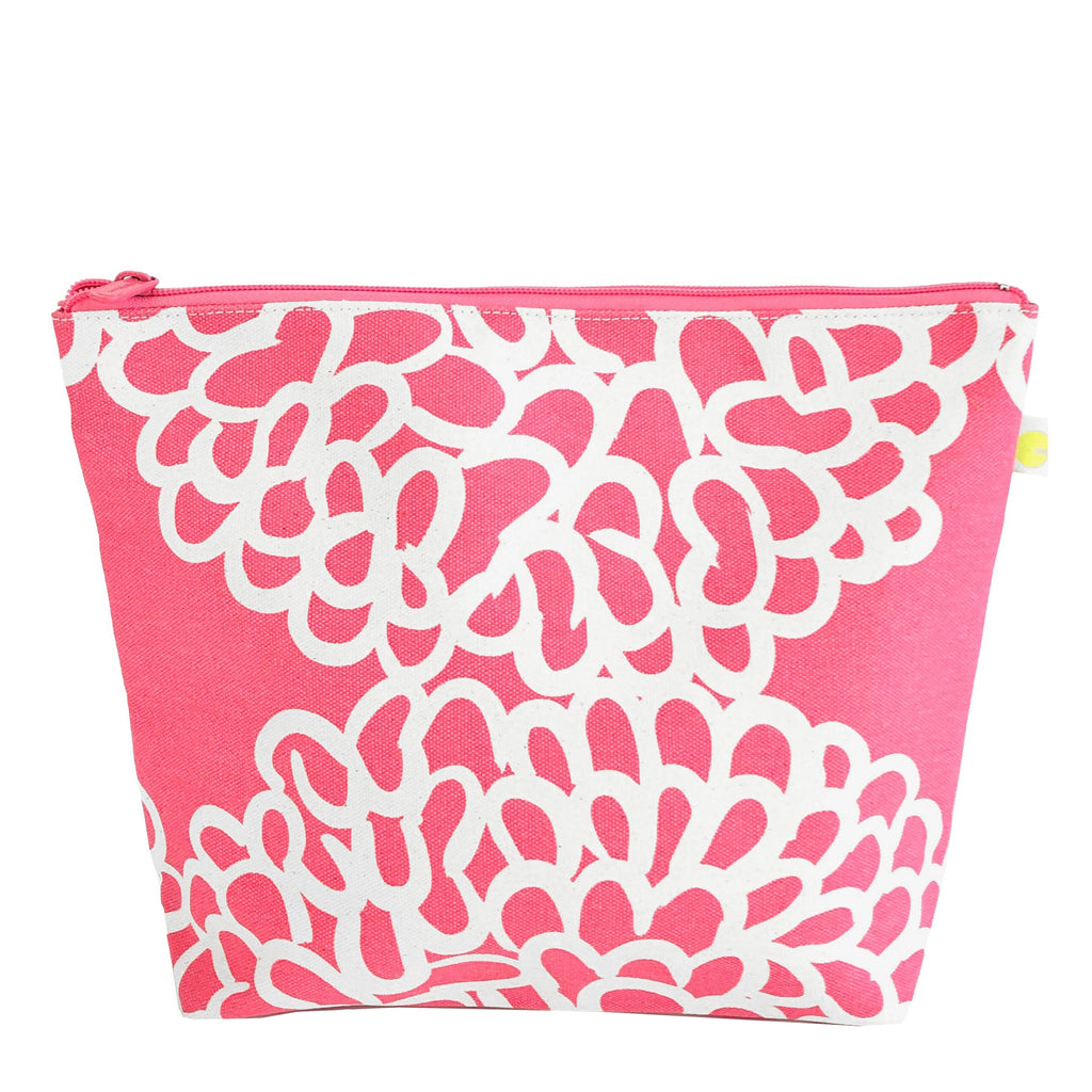 An extra large pink and white Travel Pouch Extra Large with a floral pattern by See Design.