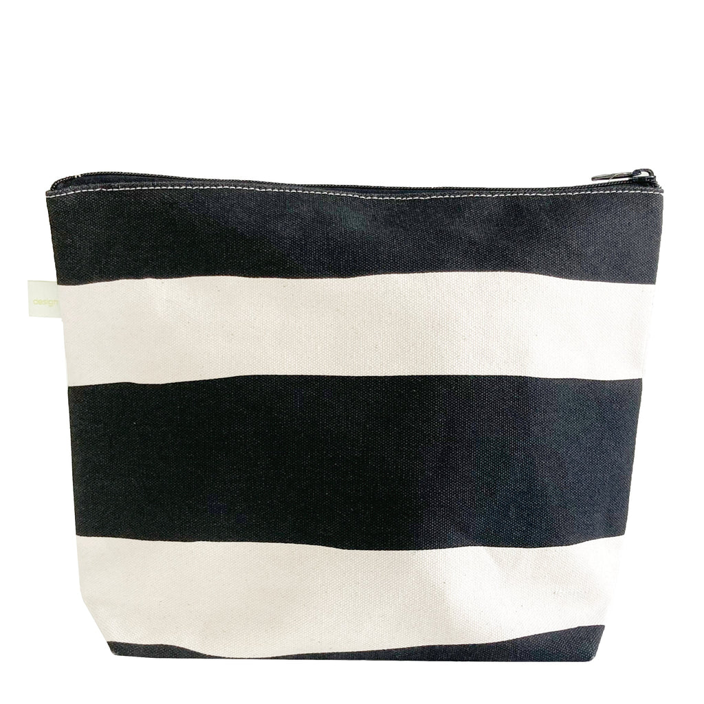 A black and white striped See Design Travel Pouch Extra Large.