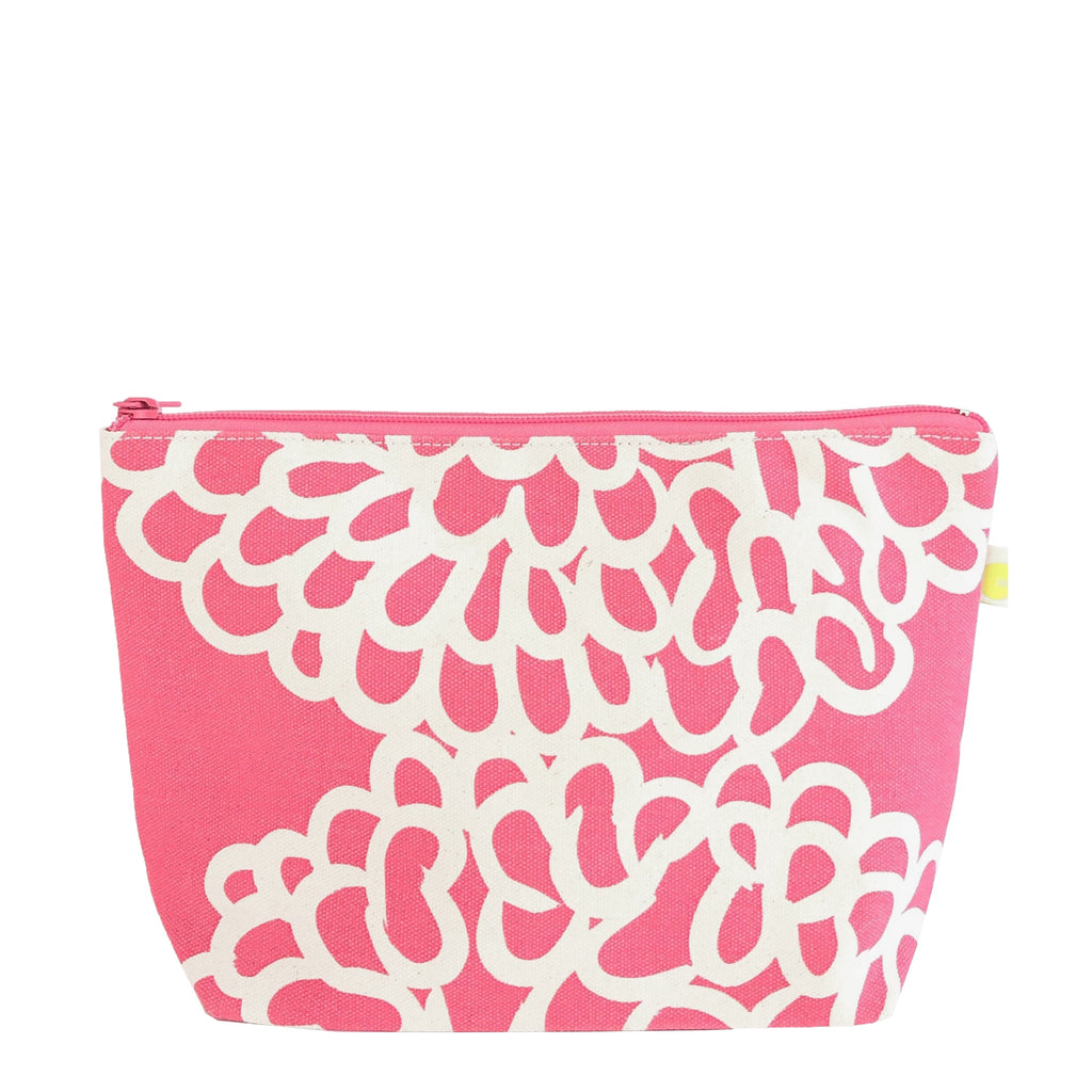 A See Design cotton canvas cosmetic bag with a floral pattern, perfect for storing travel essentials.