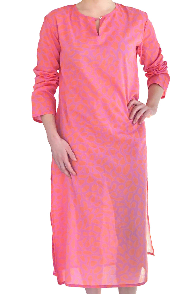 A woman wearing a lightweight and soft pink cotton voile See Design Tunic Full Length.