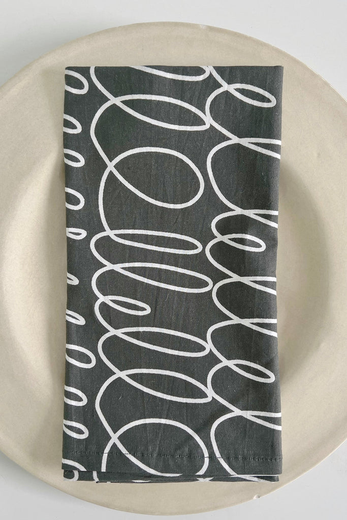 A See Design napkins (Set of 4) on a dinner table.