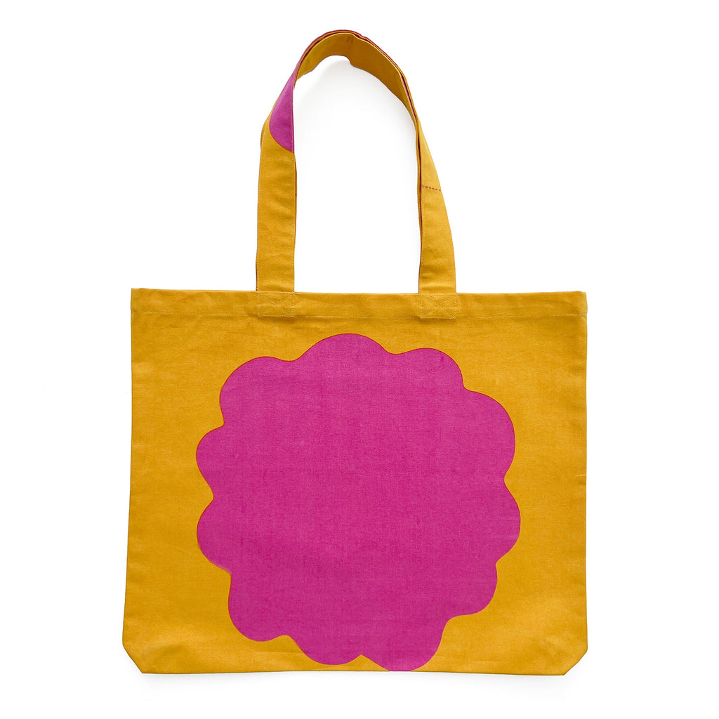 A lightweight cotton canvas graphic tote bag with hand-painted flower artwork from See Design.