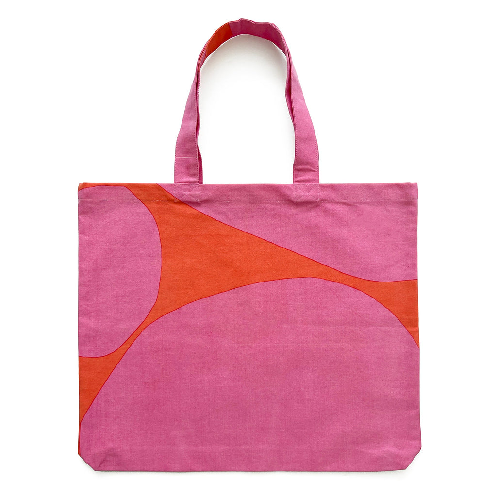A lightweight Graphic Tote Bag with a hand-painted artwork by See Design in pink and orange.