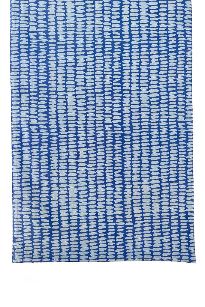 A See Design table runner with blue and white stripes on a white background.