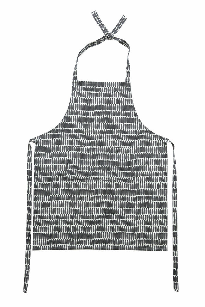 A See Design hand-painted kitchen apron with black and white patterns.