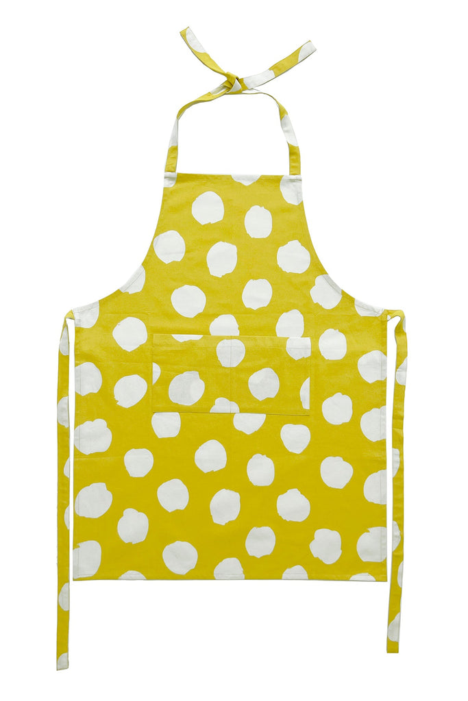 A hand-painted yellow and white polka dot See Design kitchen apron.