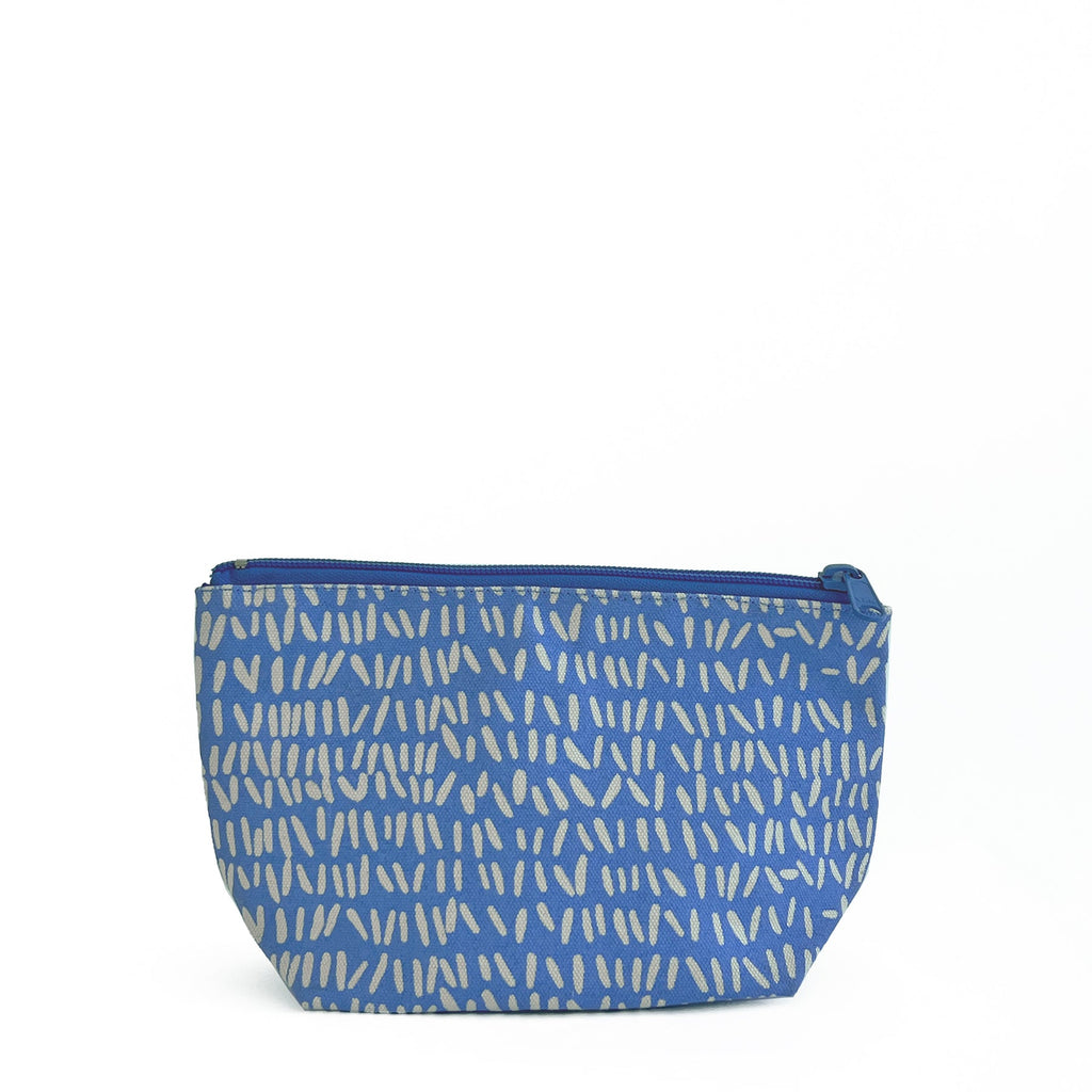 A See Design Travel Pouch Small with a zig zag pattern.