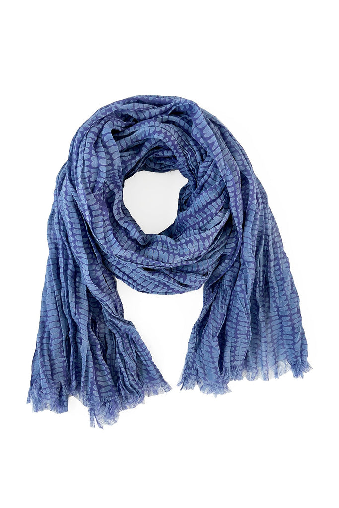 A vibrant blue Cotton Scarf on a white background by See Design.