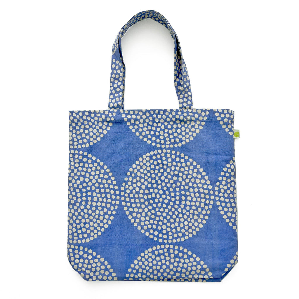 An Easy Tote Bag by See Design, lightweight blue and white polka dot cotton canvas with hand-painted artwork.