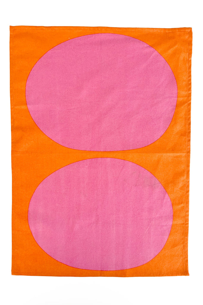 Two vibrant patterns of hand painted designs on See Design tea towels (Set of 2), featuring orange and pink squares, set against a white background.