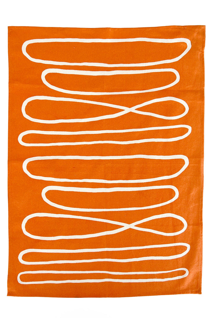 A vibrant orange Tea Towels (Set of 2) with hand-painted white lines on it by See Design.