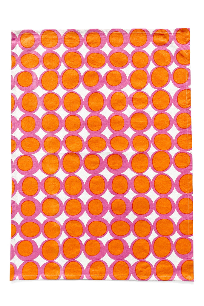 A vibrant tea towel (set of 2) with hand painted circles on it by See Design.