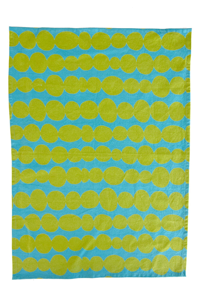 A vibrant blue and yellow Tea Towels (Set of 2) with hand painted dots on it by See Design.