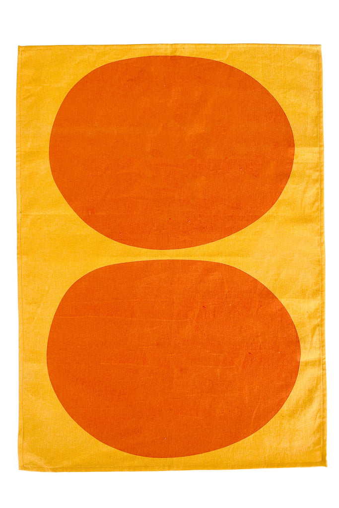 A vibrant See Design Tea Towels (Set of 2) with hand-painted oval designs.