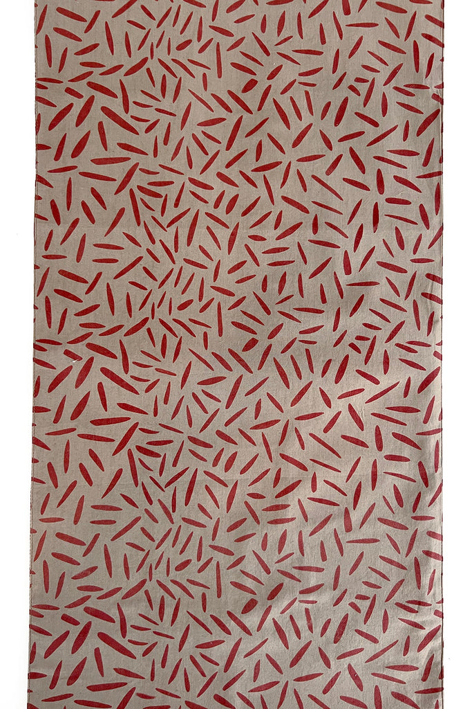 A See Design table runner with red and white stripes on it, perfect for coordinating napkins or table runners with prints and colors.