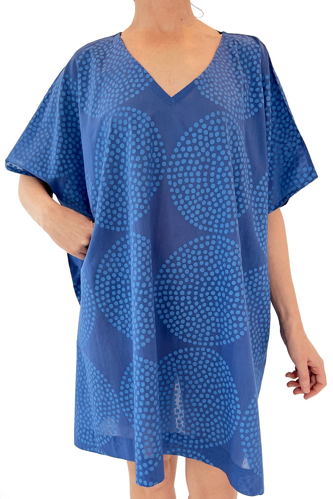 A lightweight woman wearing a See Design Caftan.
