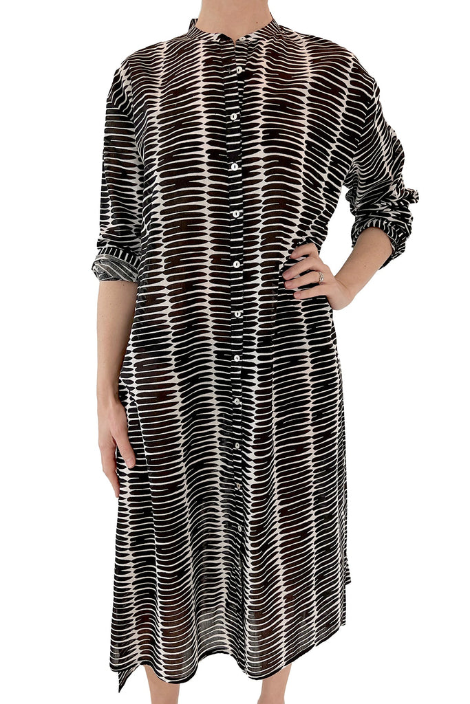 A versatile woman wearing a comfortable See Design shirt dress.