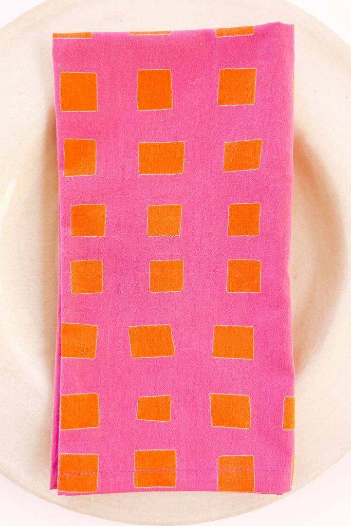 A See Design cotton napkin on a plate.