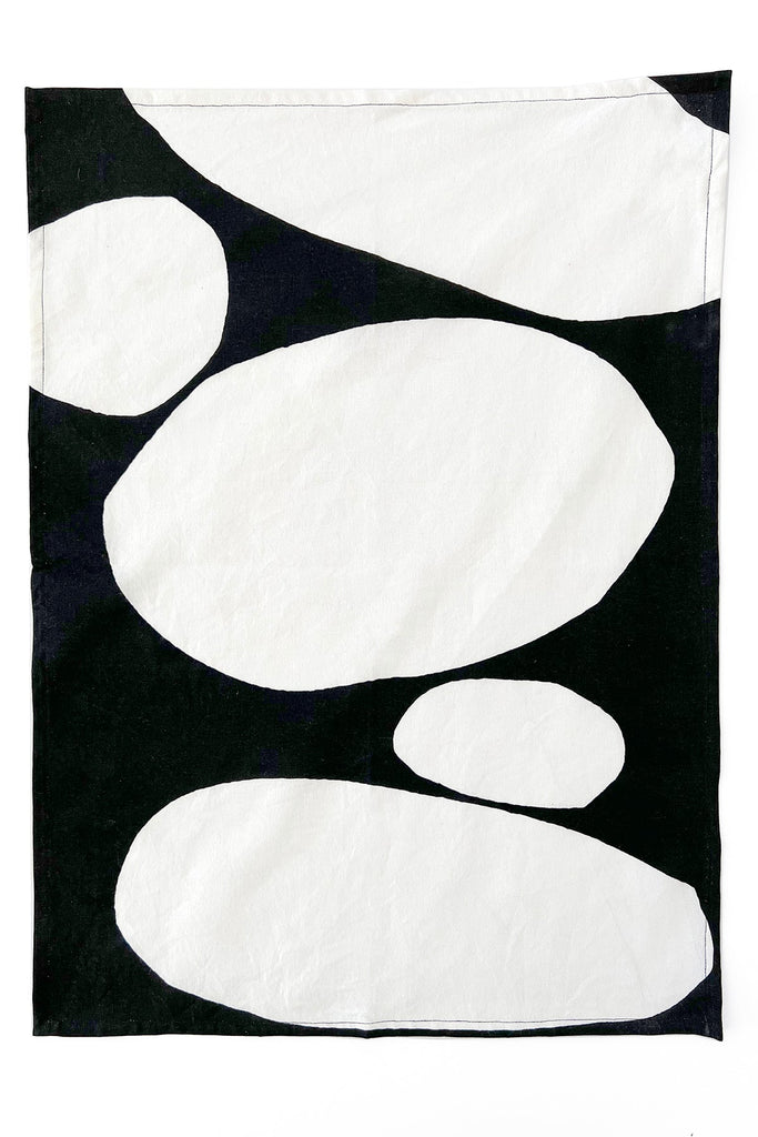 A black and white See Design cotton Tea Towels (Set of 2) with circles on them, perfect for cleaning and drying dishes in a vibrant pattern.