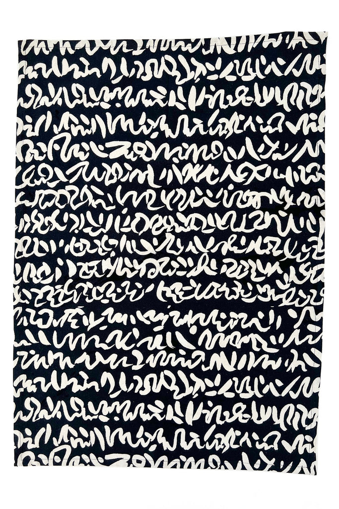 A black and white Tea Towels (Set of 2) with vibrant patterns by See Design.