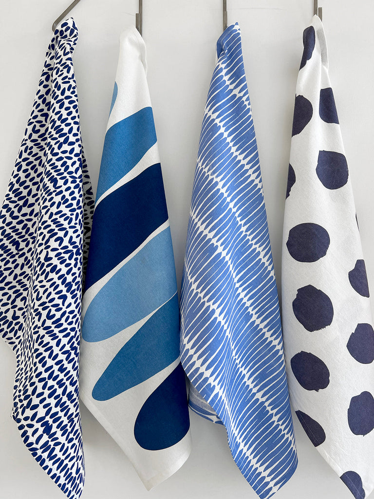 Colorful See Design tea towels (Set of 2) in a kitchen setting.