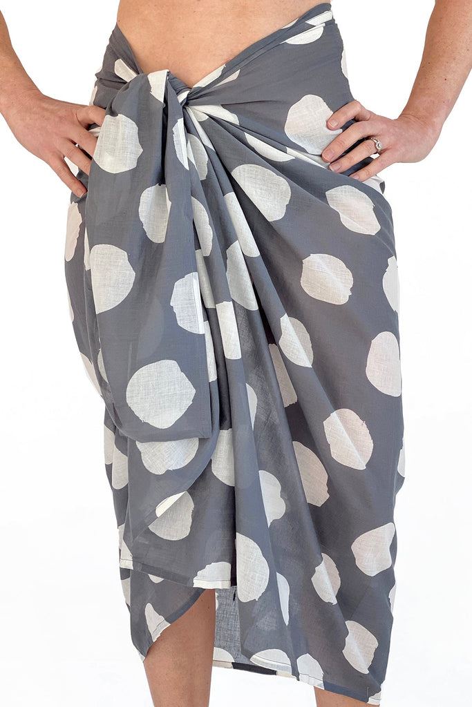 A fashionable woman wearing a See Design sarong made of lightweight cotton.